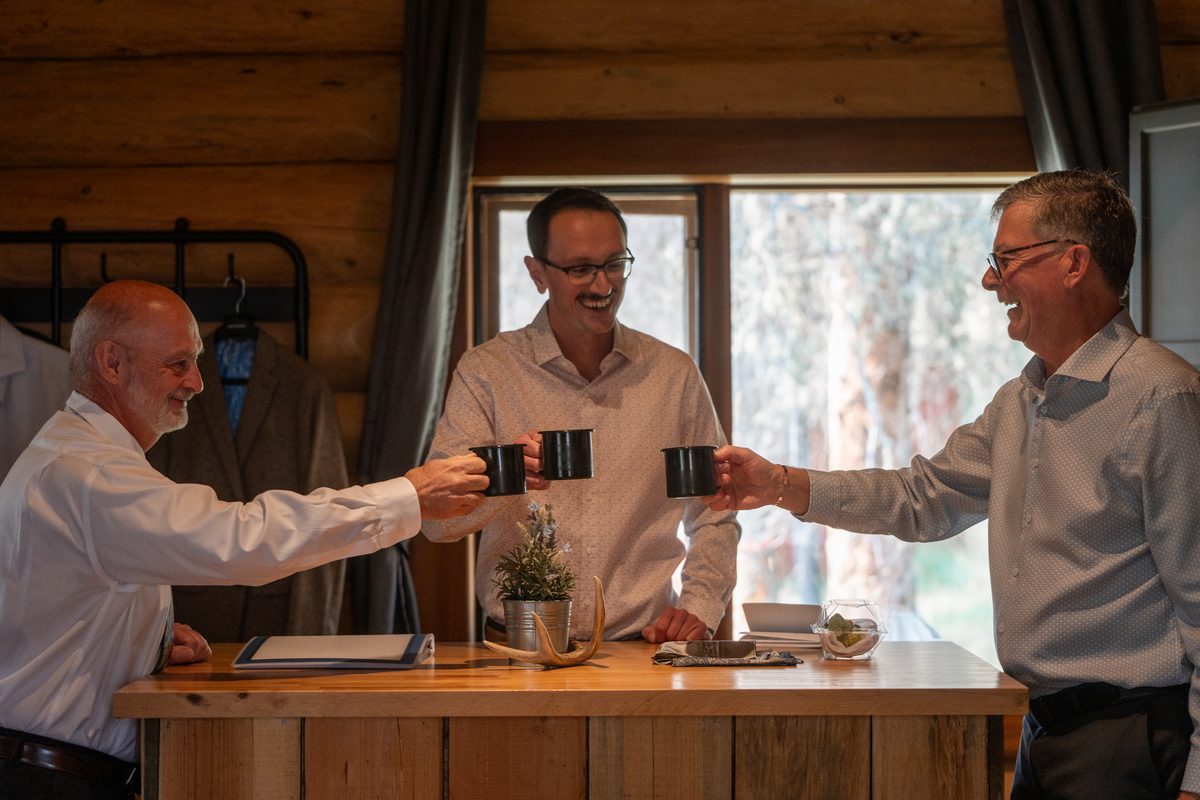 A celebratory toast at a mountain wedding